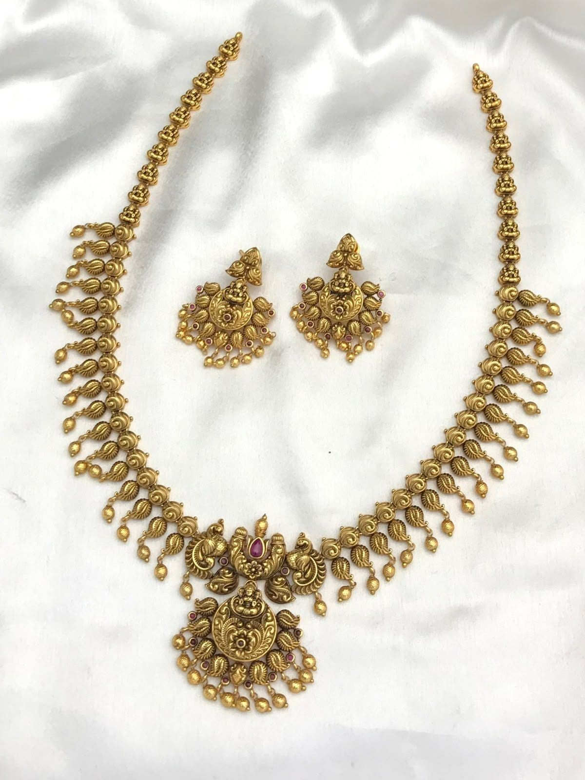 My Store antique gold-toned necklace and earring set with temple motifs, ruby stones, and hanging bead details.