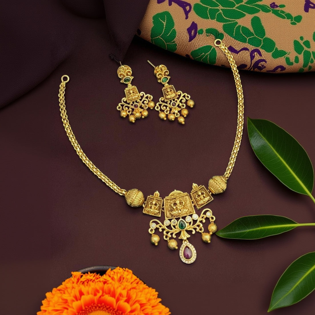 My Store gold-toned temple jewelry necklace and earring set with intricate motifs, green and ruby stones, and beads.