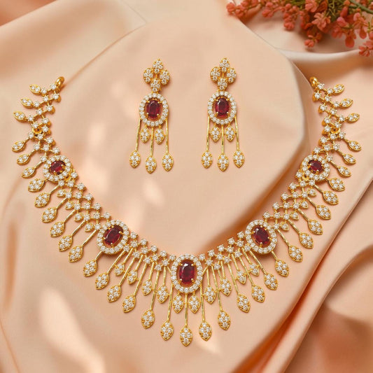 My Store gold-tone floral necklace and earring set with oval red gemstones and shimmering crystals on satin fabric.