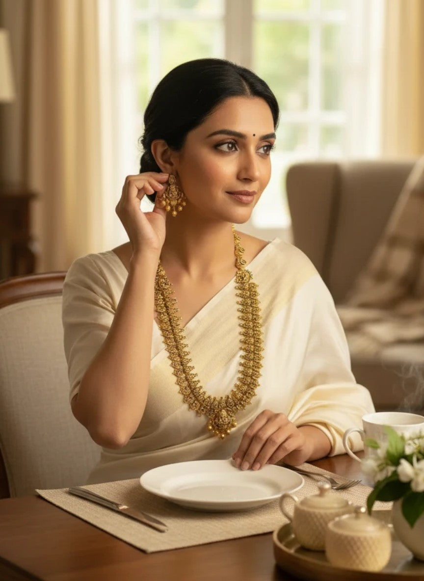 My Store antique gold temple jewelry necklace and earrings set worn by a woman in a white saree