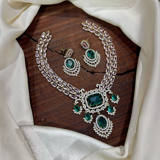 My Store Emerald Noorah Royale necklace and earring set with green stones, blush pink accents, and crystal halos.