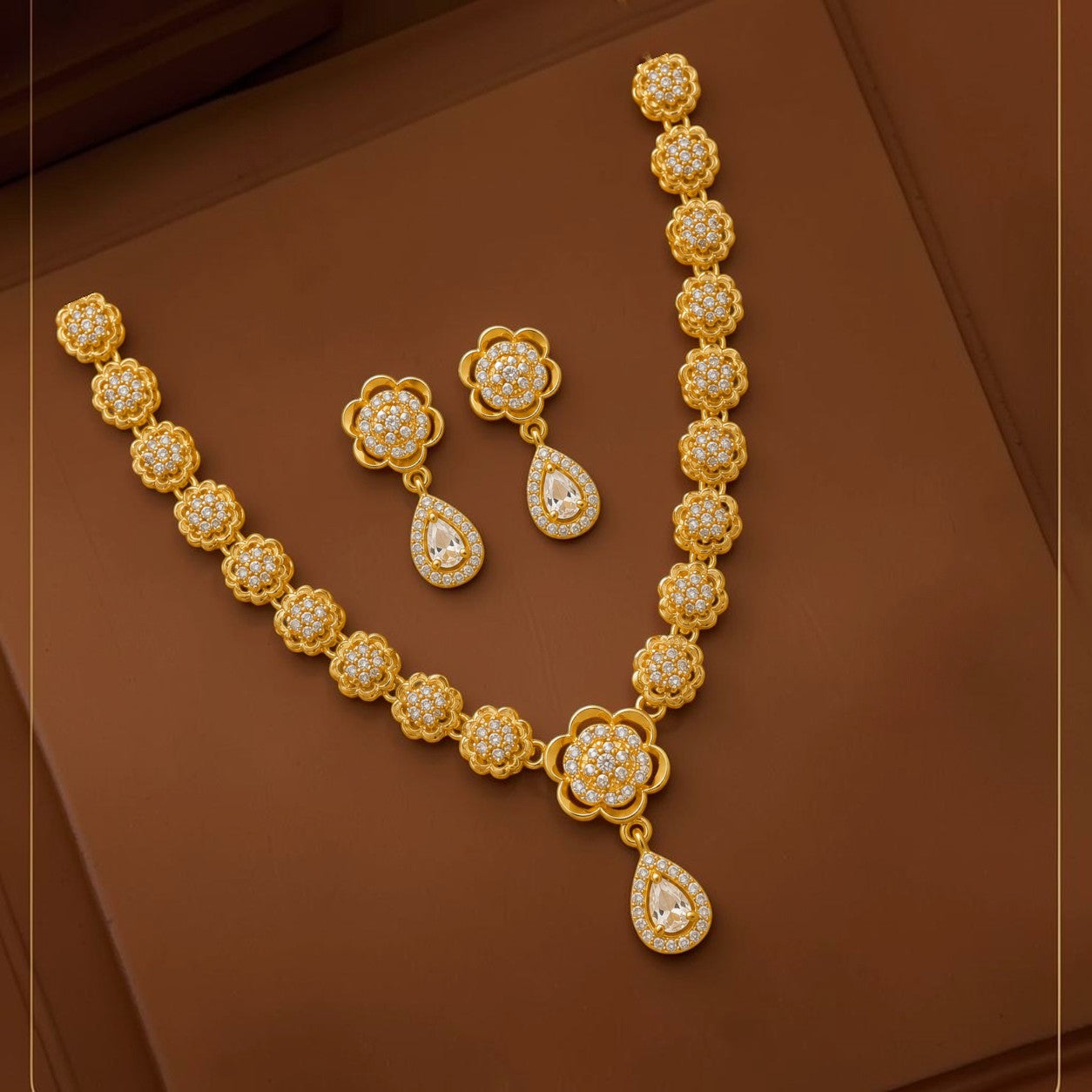 My Store gold-tone floral necklace and earring set with shimmering white stones and teardrop accents.
