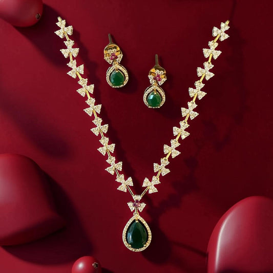 My Store gold-tone jewelry set featuring a teardrop green pendant necklace and matching floral-inspired earrings.