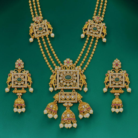 My Store Kundan-style triple line haram necklace set with white stones, green accents, and pearl jhumka earrings.