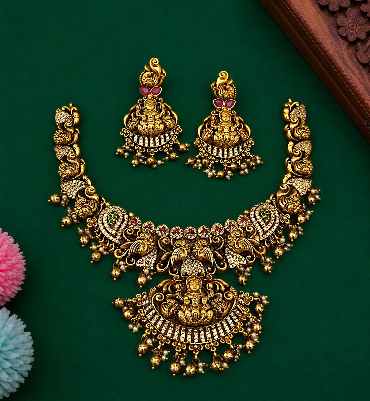 My Store traditional temple jewelry necklace and earring set in matte gold with deity motifs, red and green stone inlays.