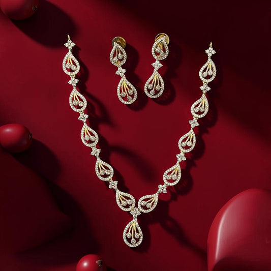 My Store elegant gold-tone teardrop diamond necklace and earring set with pave detailing on a deep red background